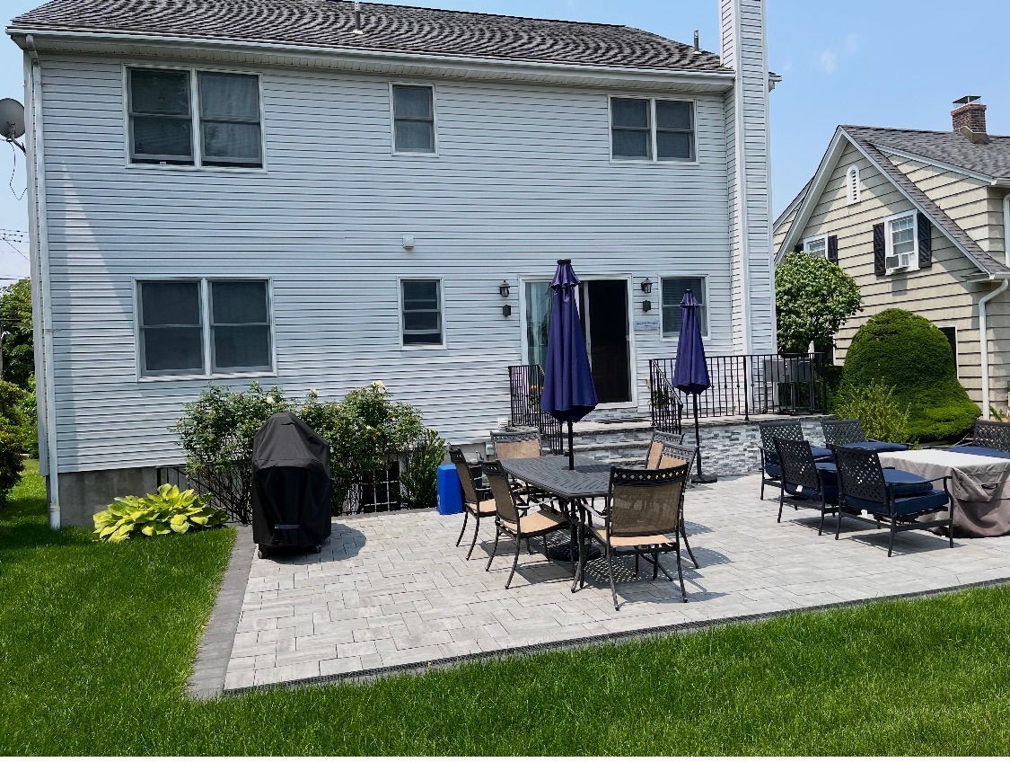 After: lush lawn and flagstone complete