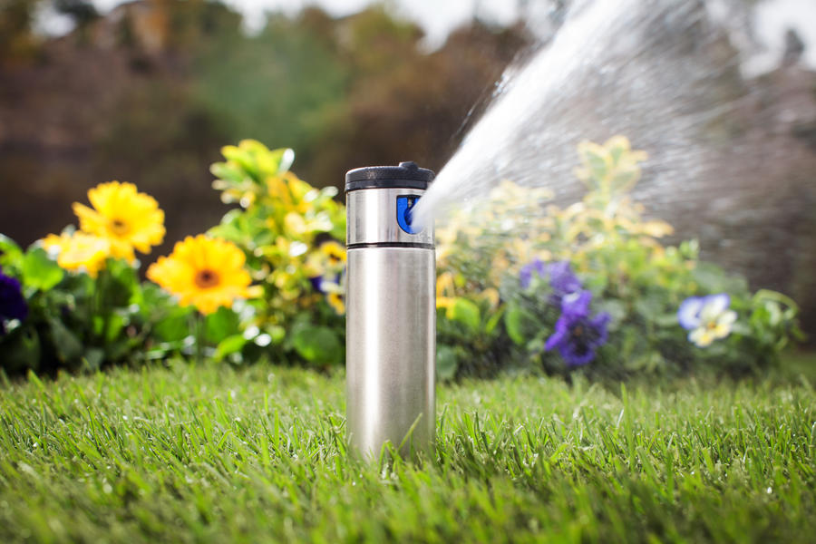 Automatic sprinkler head watering flowers